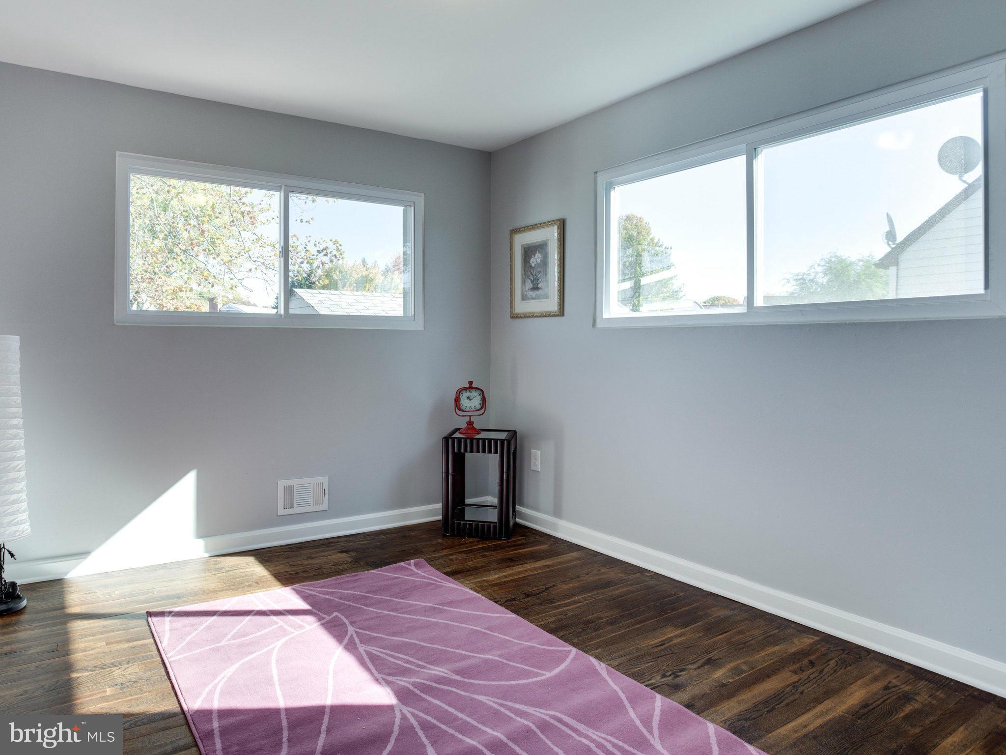 235 North Hammonds Ferry Road Linthicum, MD 21090 - Photo 14 of 30 a bedroom with a bed and a window
