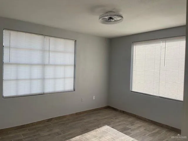 a view of an empty room with a window