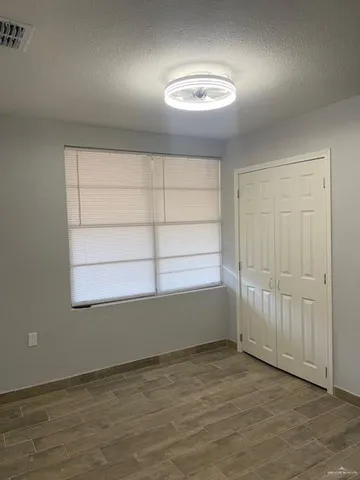 an empty room with a empty space and window