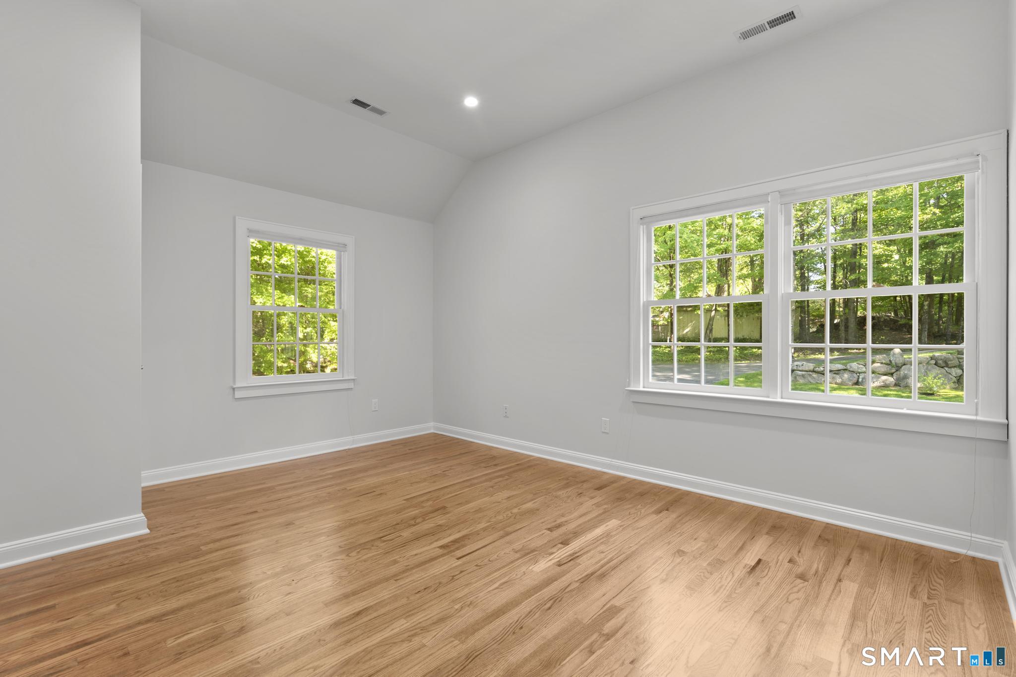 181 Old Branchville Road Ridgefield, CT 06877 - Photo 19 of 40 wooden floor in an empty room with a window