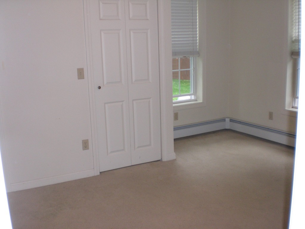 3 Oakham Road North Brookfield, MA 01535 - Photo 12 of 24 an empty room with a empty space and windows