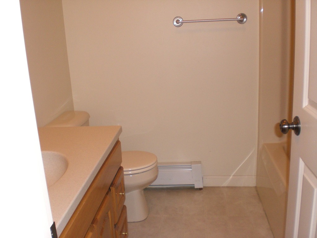 3 Oakham Road North Brookfield, MA 01535 - Photo 17 of 24 a white toilet sitting next to a shower