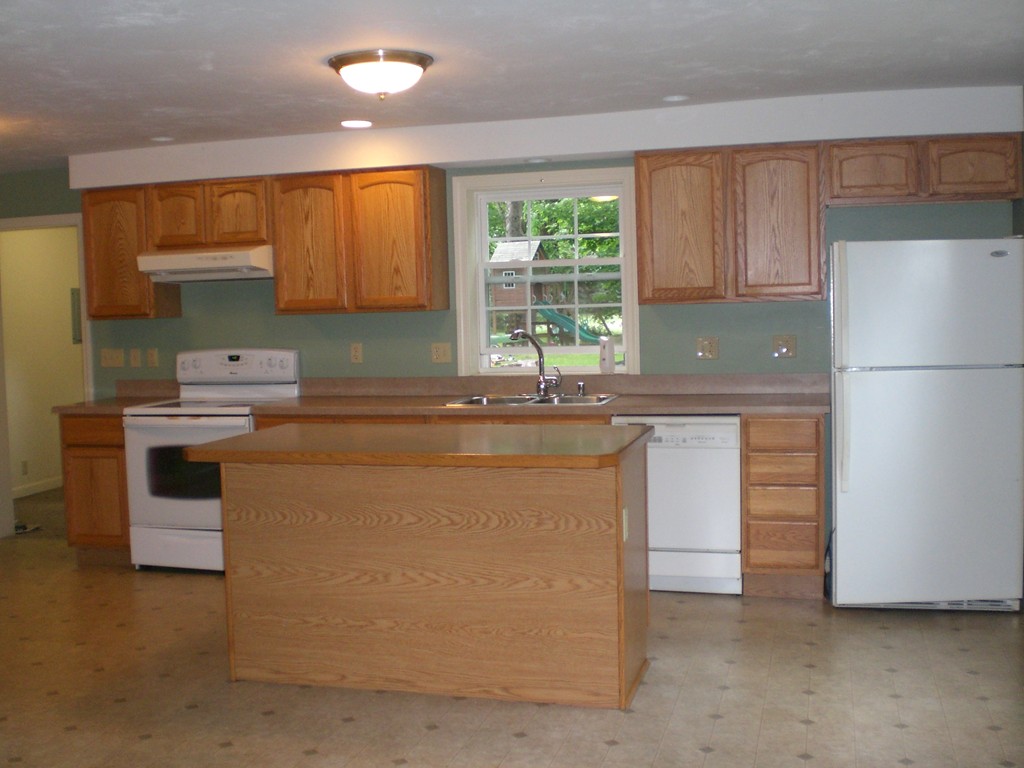 3 Oakham Road North Brookfield, MA 01535 - Photo 6 of 24 a kitchen with appliances a sink and a cabinets