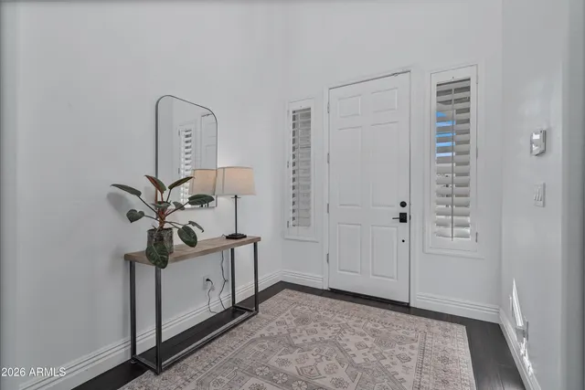 a view of a garden with lawn chairs and couches