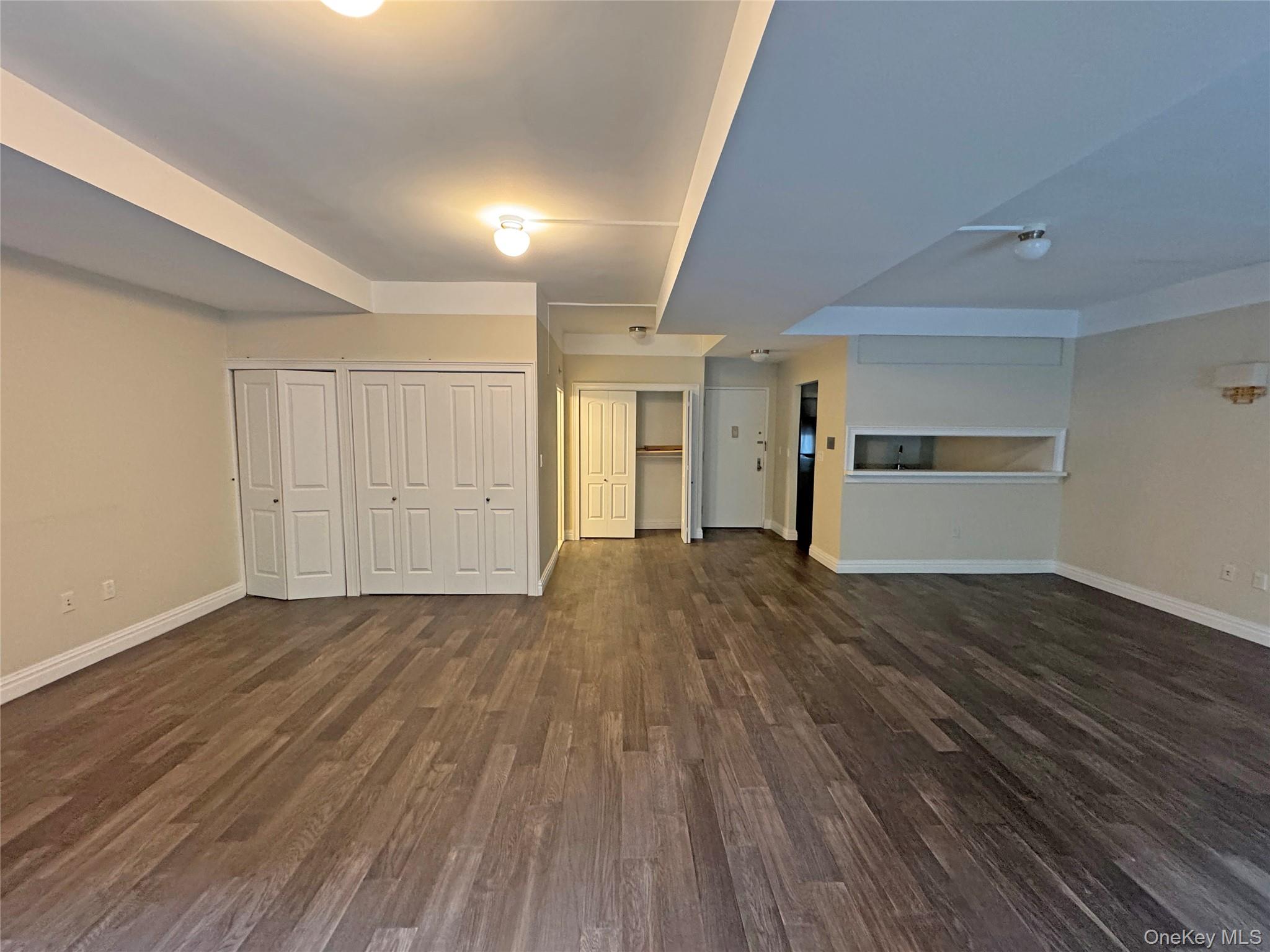 280 Rector Place, Unit 1G Manhattan, NY 10280 - Photo 11 of 17 a view of empty room with wooden floor