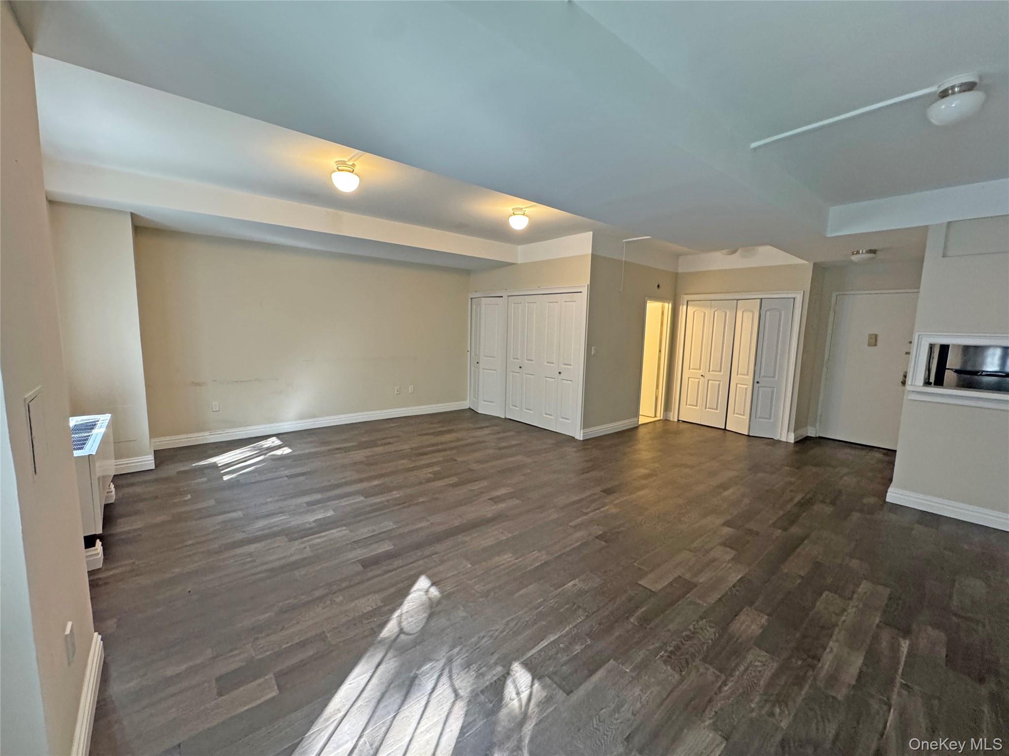 280 Rector Place, Unit 1G Manhattan, NY 10280 - Photo 10 of 17 a view of livingroom with hardwood floor and a ceiling fan