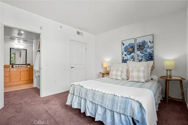 a bathroom with a double vanity sink mirror and shower