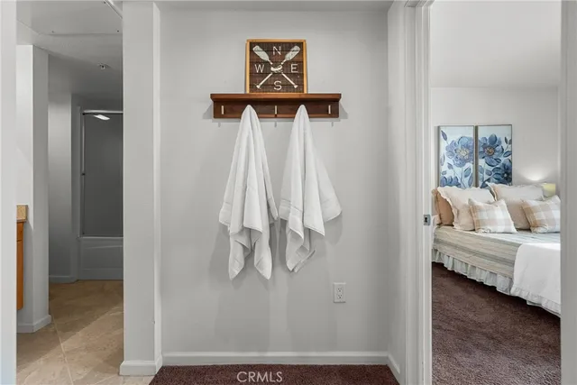 a bathroom with a granite countertop sink and a bathtub
