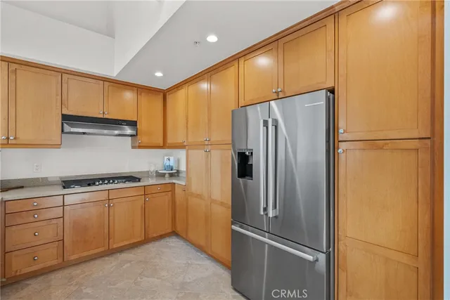 a living room with furniture fireplace and a window