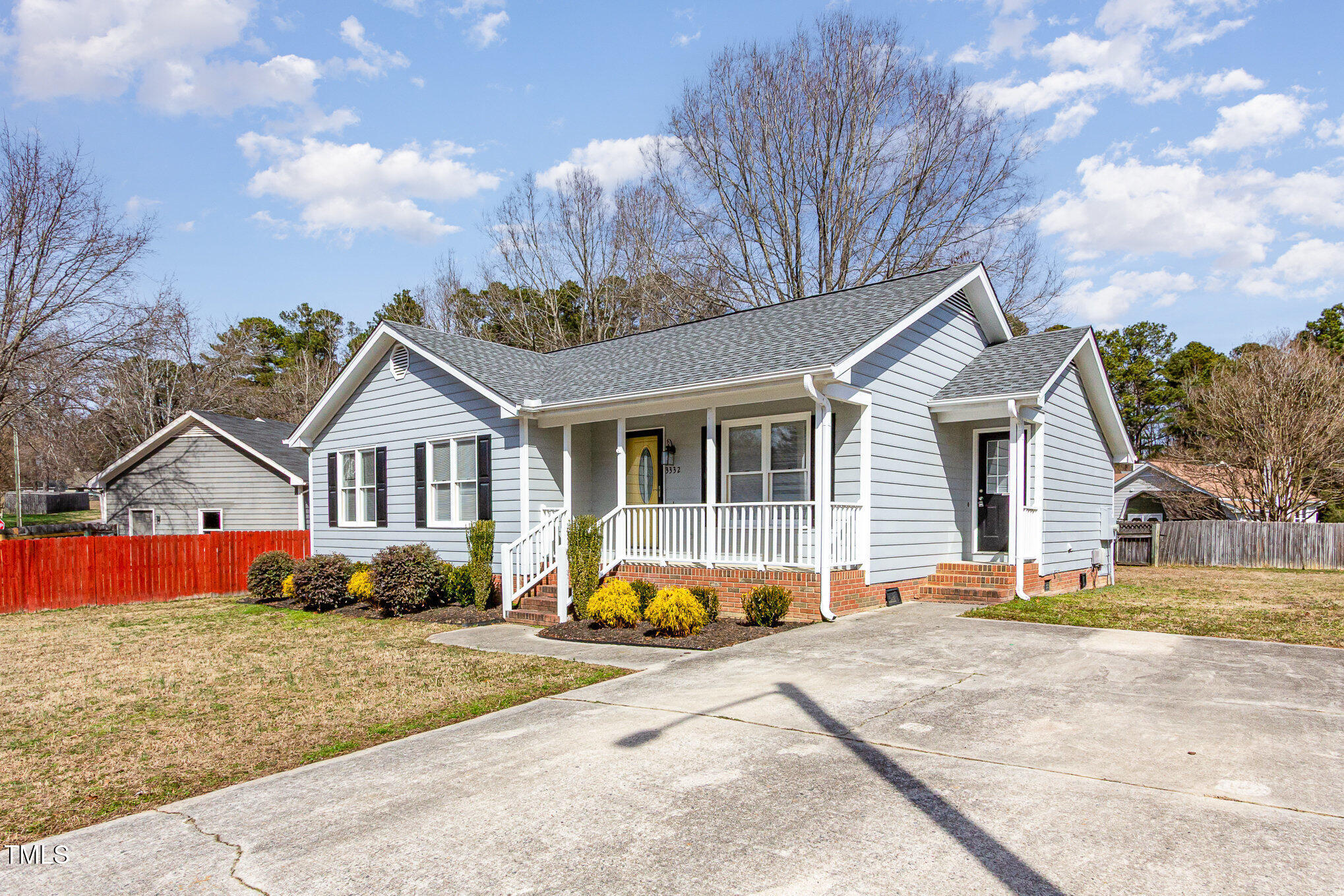 3332 Castlegate Drive Raleigh, NC 27616 - Photo 3 of 22 a front view of a house with garden