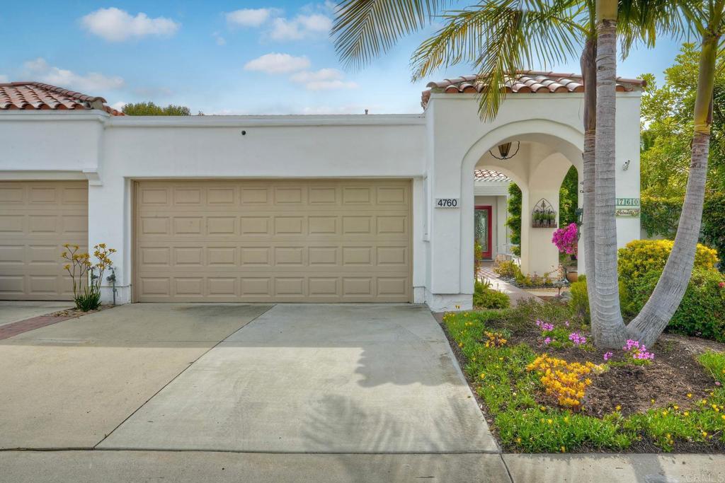 4760 Galicia Way Oceanside, CA 92056 - Photo 2 of 56 a couple of potted plants in front of door