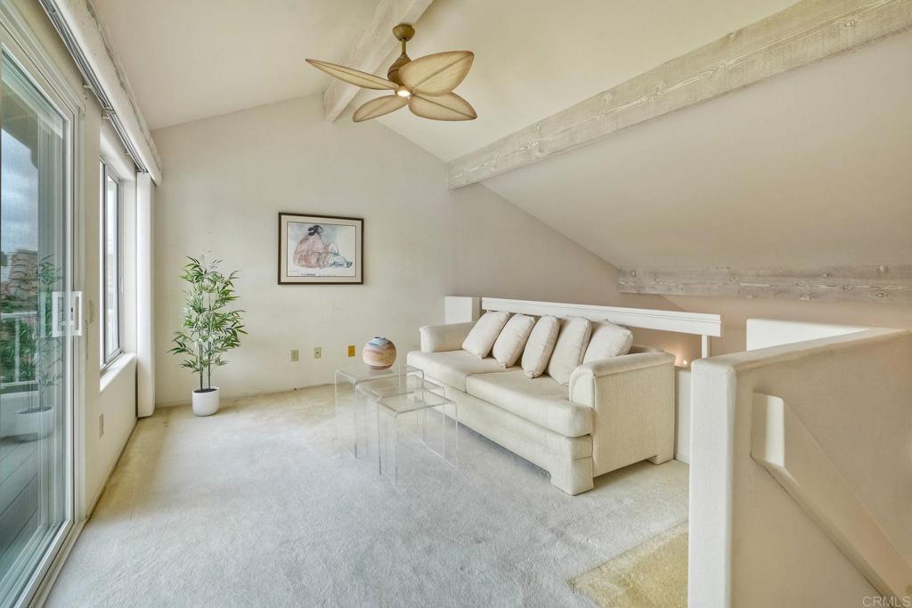 4760 Galicia Way Oceanside, CA 92056 - Photo 24 of 56 a view of a livingroom with a couch and a large window