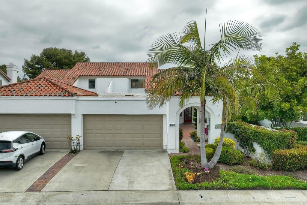 4760 Galicia Way Oceanside, CA 92056 - Photo 35 of 56 a front view of a house with garden