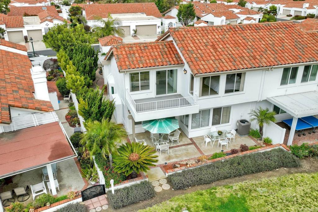 4760 Galicia Way Oceanside, CA 92056 - Photo 41 of 56 a front view of a house with garden