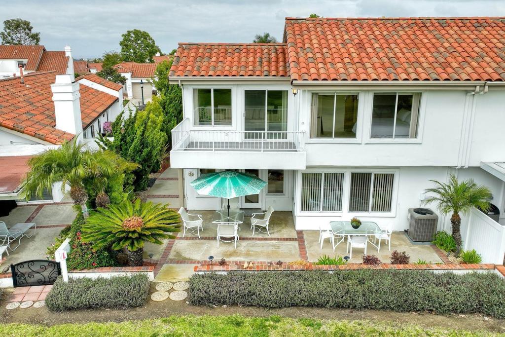 4760 Galicia Way Oceanside, CA 92056 - Photo 42 of 56 a front view of a house with a yard