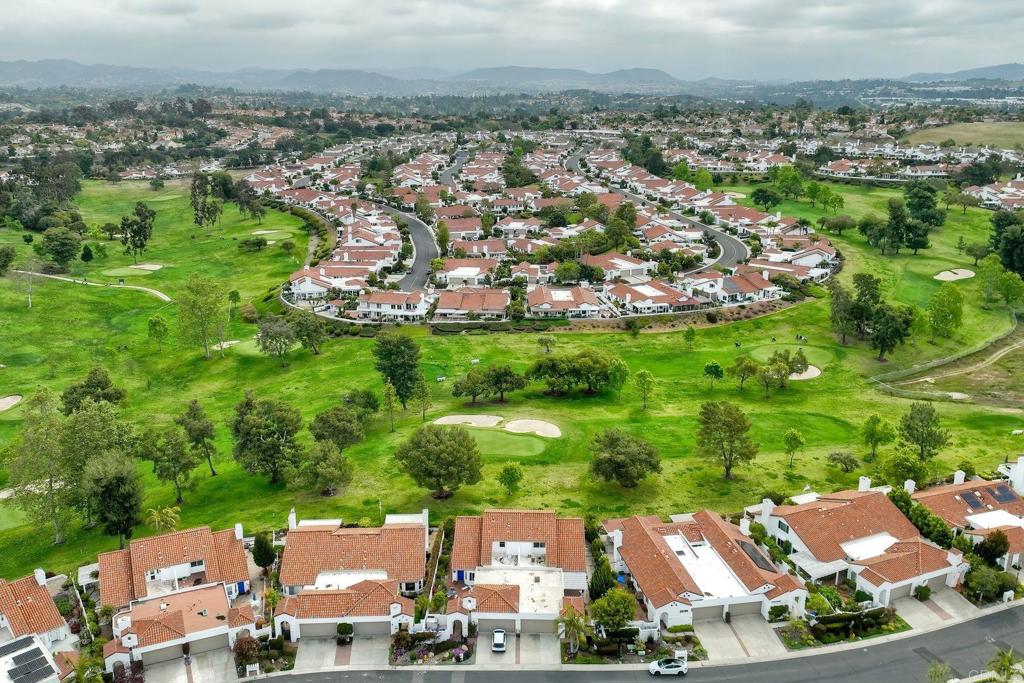 4760 Galicia Way Oceanside, CA 92056 - Photo 46 of 56 an aerial view of a house with a garden