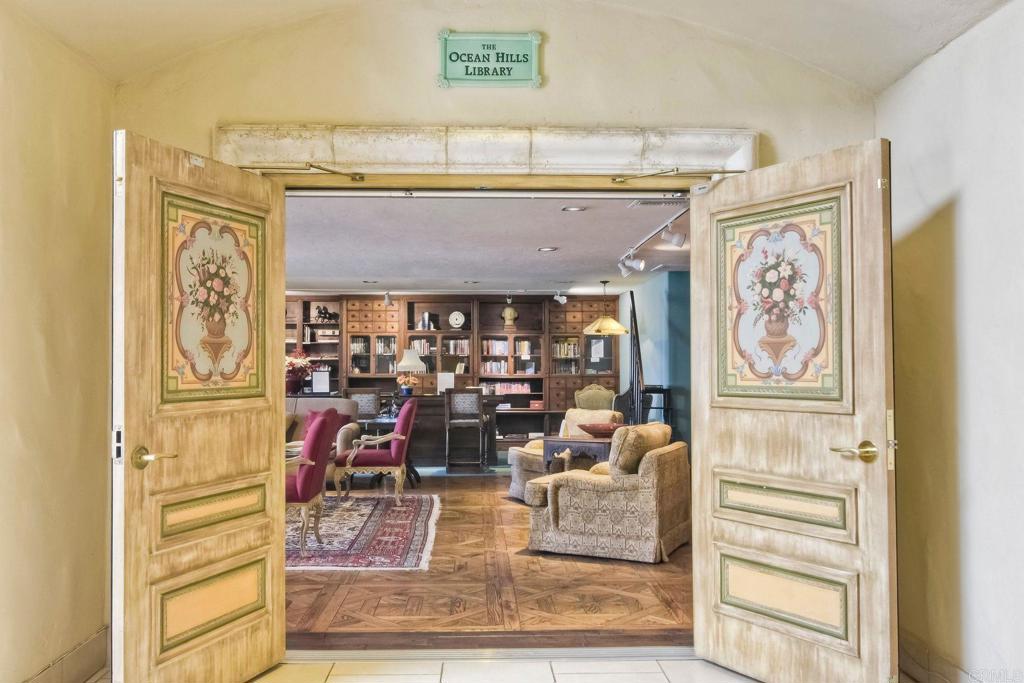 4760 Galicia Way Oceanside, CA 92056 - Photo 48 of 56 a view of a entryway with furniture and chandelier
