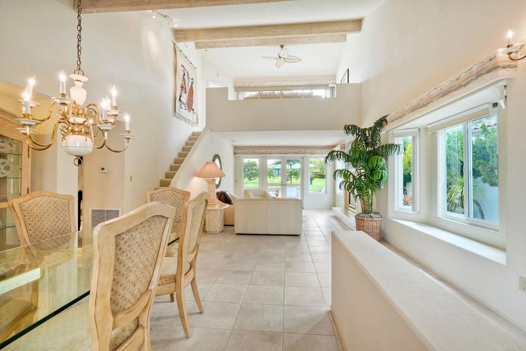 4760 Galicia Way Oceanside, CA 92056 - Photo 6 of 56 a living room with furniture and a large window