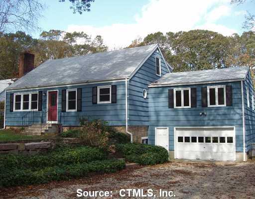 63 Roxbury Road East Lyme, CT 06357 - Photo 1 of 1 a front view of a house with windows and yard