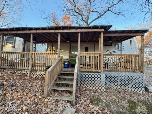 an outdoor view of a house with a porch