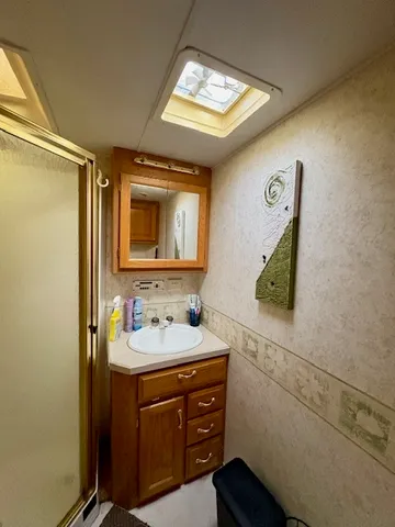 a bathroom with a sink and a mirror