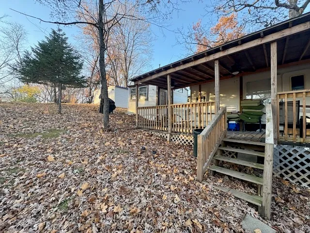 front view of a house with wooden fence