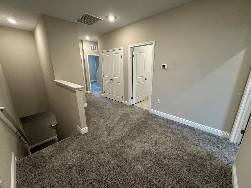 16434 Hamlin Hills Road Winter Garden, FL 34787 - Photo 20 of 50 en empty room with an entryway