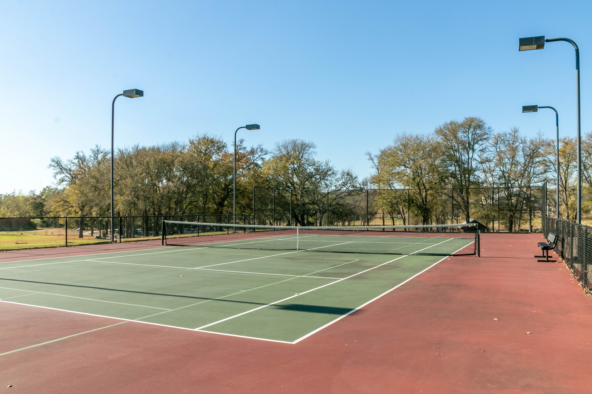 165 Maddy Way Bastrop, TX 78602 - Photo 13 of 23 a view of a tennis court