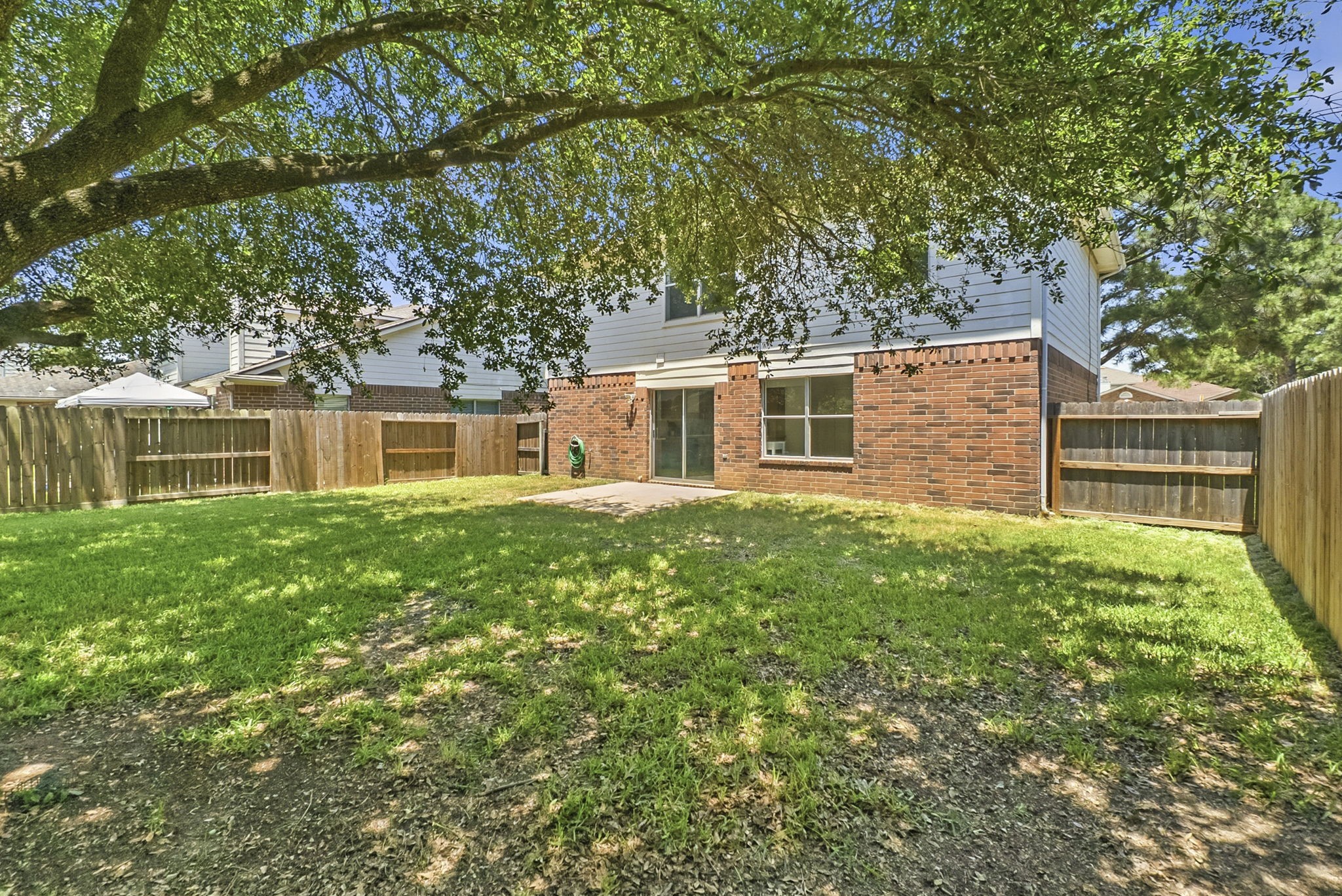 11907 Ezekiel Road Tomball, TX 77375 - Photo 38 of 39 a front view of a house with a garden