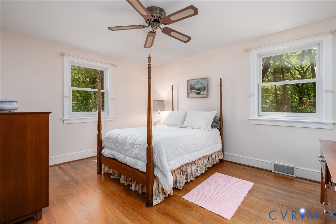 8413 Cherokee Road Richmond, VA 23235 - Photo 17 of 29 The primary bedroom has hardwood flooring, ceiling