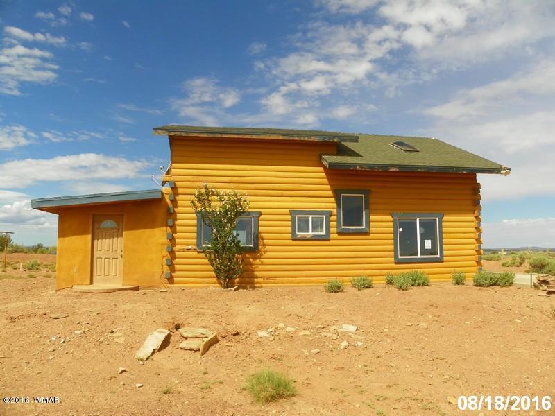 8299 Nutt Lane Snowflake, AZ 85937 - Photo 1 of 28 a front view of a house with a yard