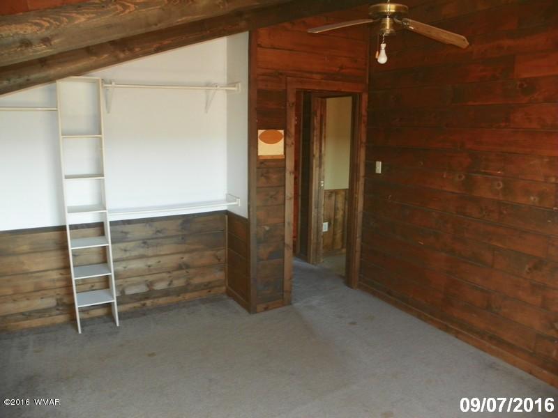 8299 Nutt Lane Snowflake, AZ 85937 - Photo 20 of 28 an empty room with walk in closet