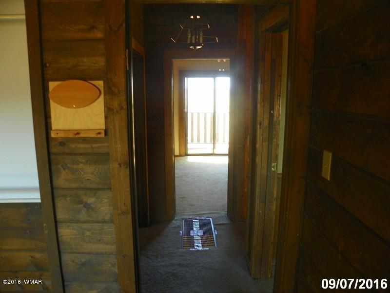 8299 Nutt Lane Snowflake, AZ 85937 - Photo 21 of 28 a bathroom with a glass door shower door