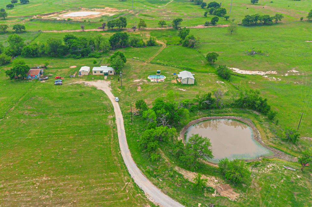 2441 McVoid Road Springtown, TX 76082 - Photo 1 of 1 a view of a garden with a lake