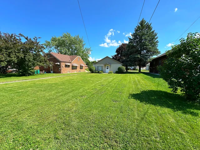 a view of a house with a big yard