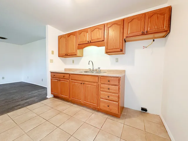 a kitchen with a sink and cabinets