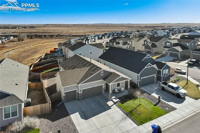 an aerial view of a house with a garden