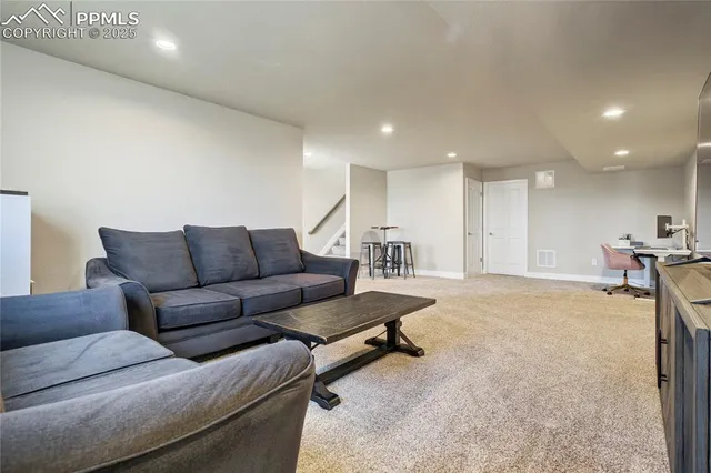 a living room with furniture and a table