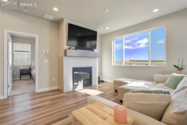 a living room with furniture and a fireplace