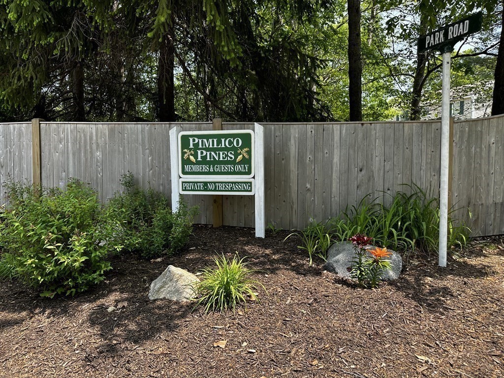 1 Park Road, Unit 1 Sandwich, MA 02644 - Photo 24 of 25 a sign that is sitting in the middle of garden