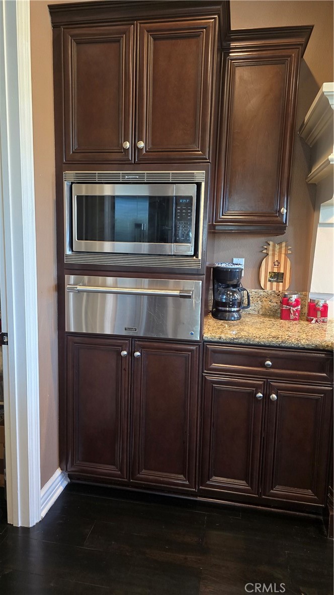 5075 Branding Iron Place Rancho Cucamonga, CA 91739 - Photo 11 of 41 a kitchen with granite countertop stainless steel appliances and wooden cabinets