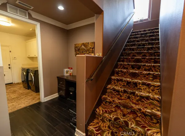 a view of entryway with wooden floor