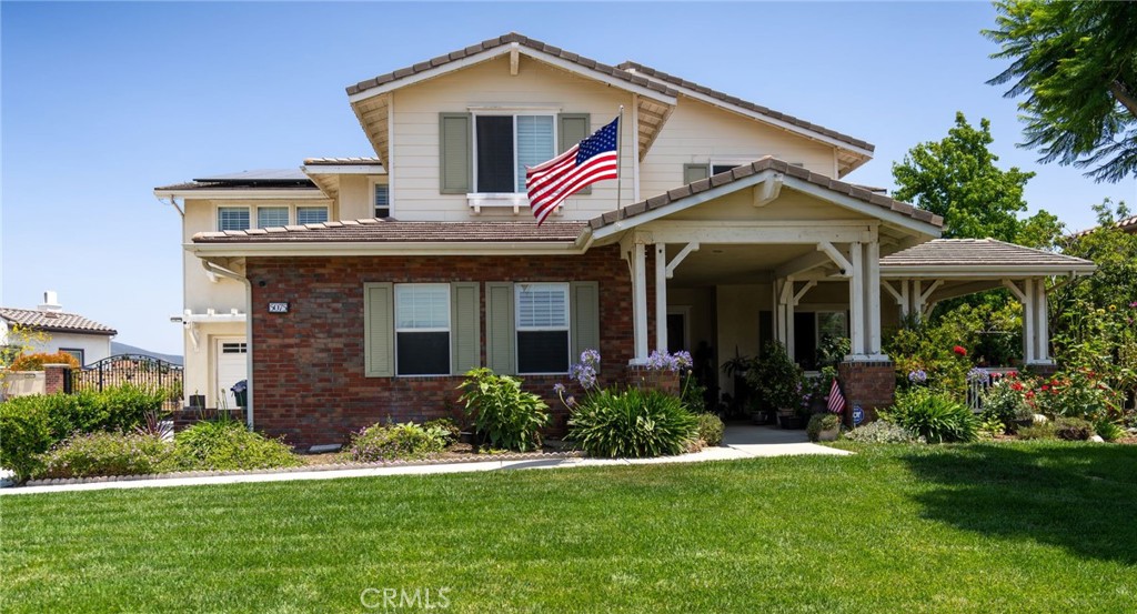 5075 Branding Iron Place Rancho Cucamonga, CA 91739 - Photo 2 of 41 a front view of a house with garden