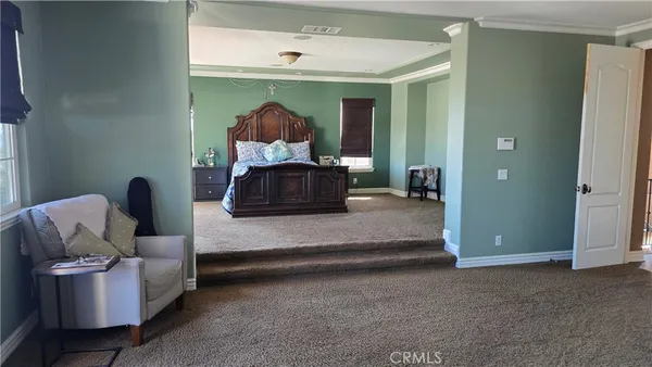 a living room with furniture and a lamp