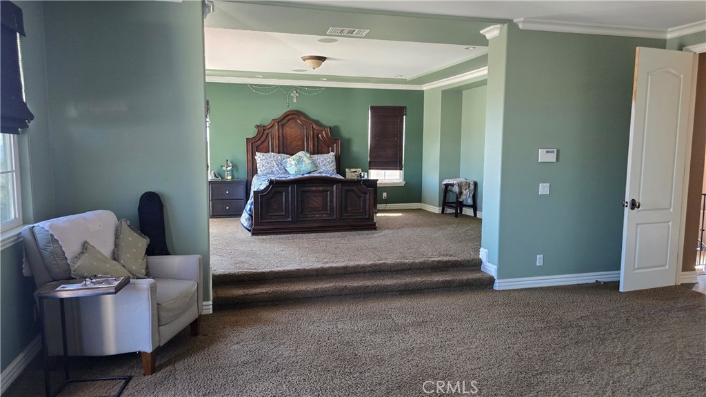 5075 Branding Iron Place Rancho Cucamonga, CA 91739 - Photo 21 of 41 a living room with furniture and a lamp