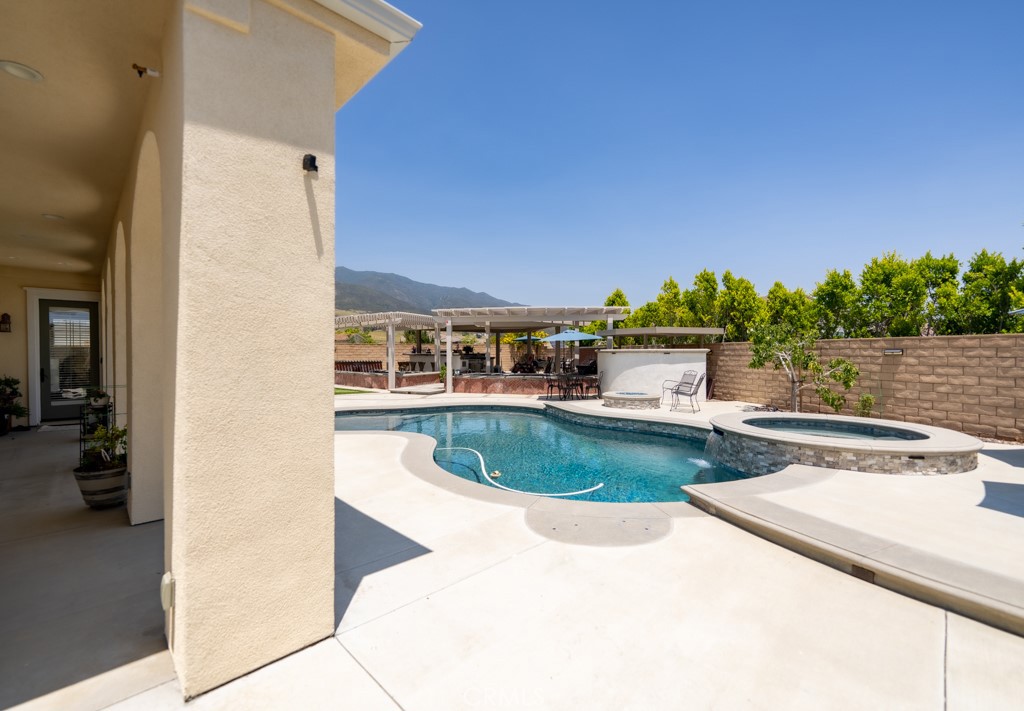 5075 Branding Iron Place Rancho Cucamonga, CA 91739 - Photo 29 of 41 a swimming pool with outdoor seating and yard