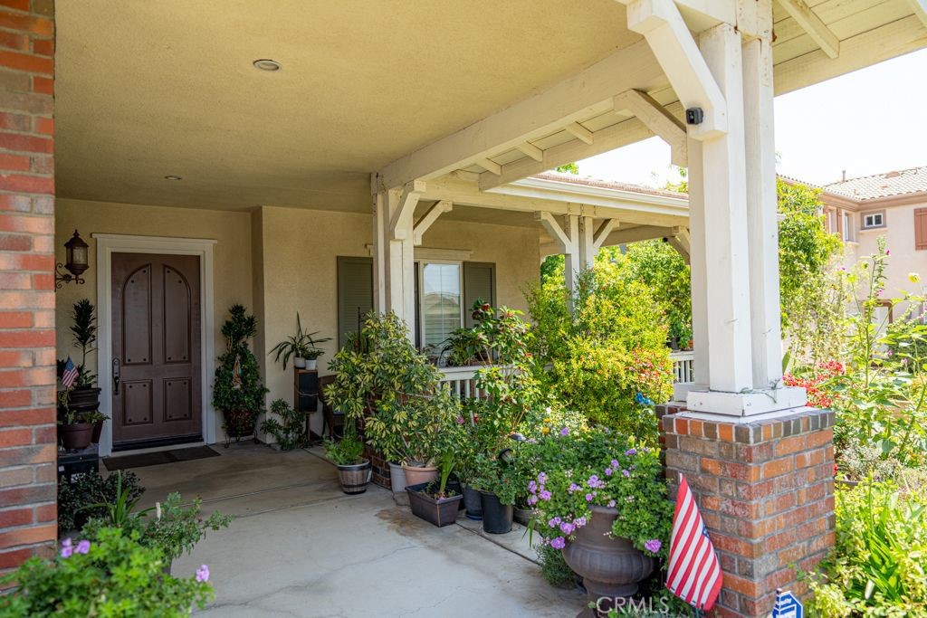 5075 Branding Iron Place Rancho Cucamonga, CA 91739 - Photo 3 of 41 a view of a house with a garden