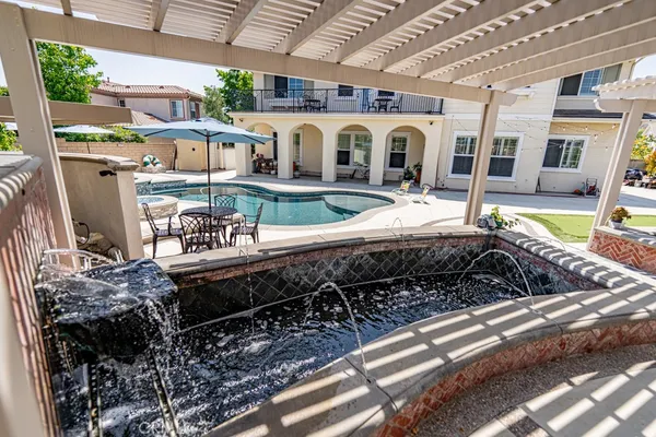 a view of a swimming pool with a patio