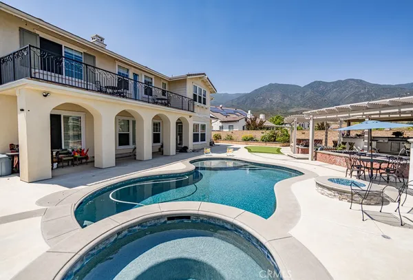 a front view of a house with swimming pool