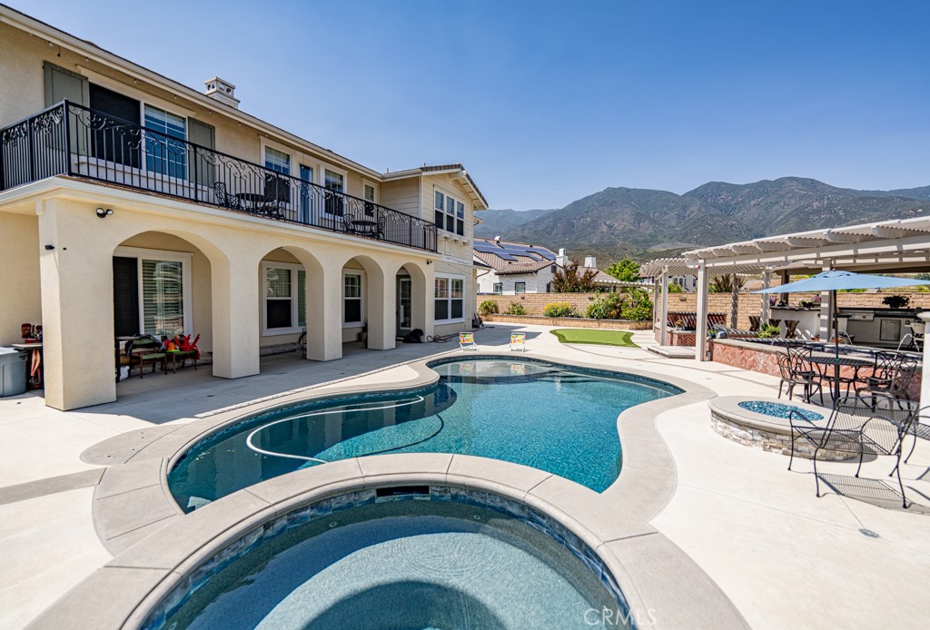 5075 Branding Iron Place Rancho Cucamonga, CA 91739 - Photo 36 of 41 a front view of a house with swimming pool